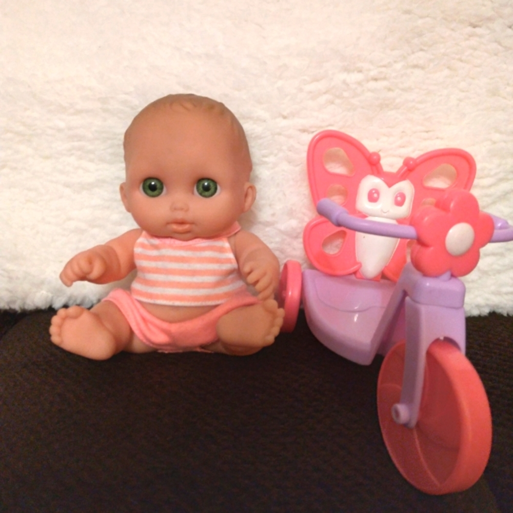 Cute Baby Doll and Pink Tricycle